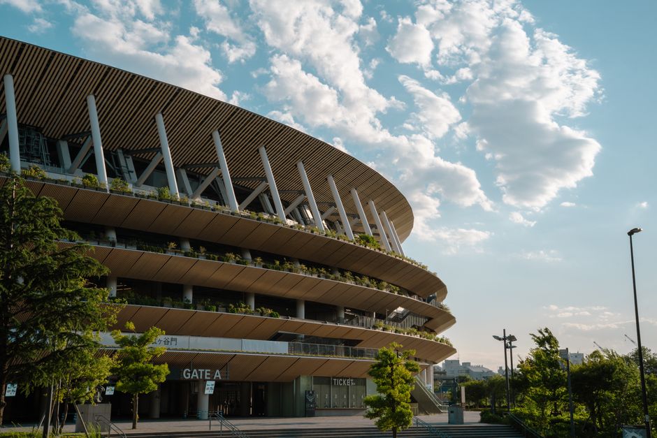 Contemporary view of a Tokyo stadium showcasing modern architecture against a clear sky.